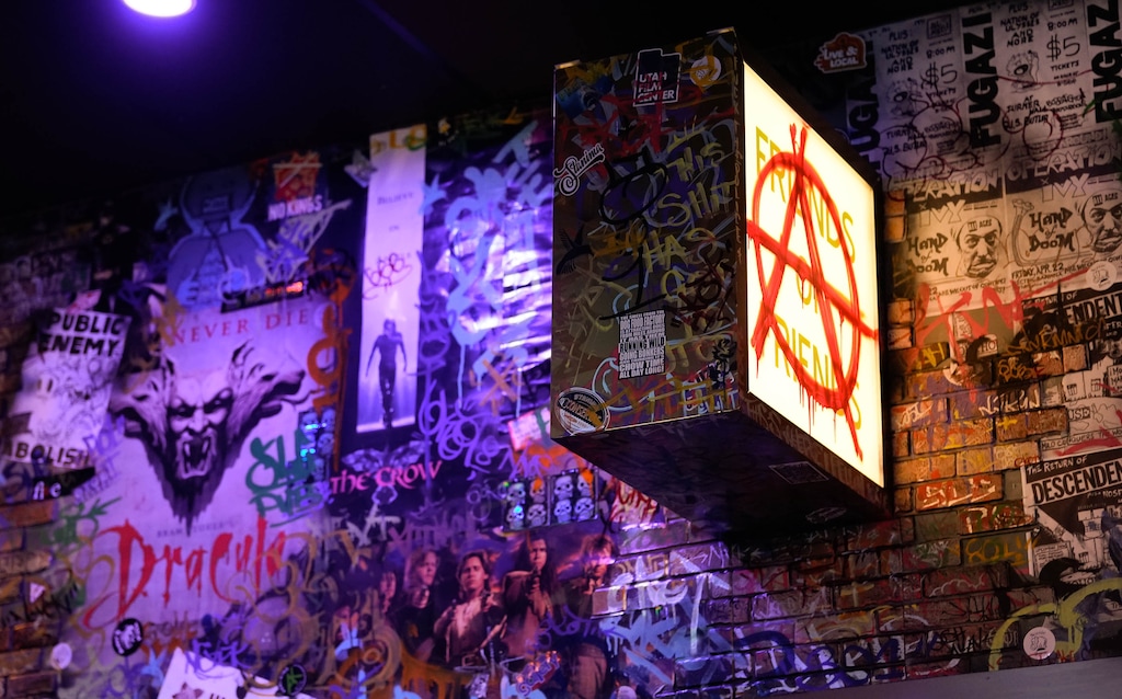 (Francisco Kjolseth | The Salt Lake Tribune) SLC Pub, recently opened inside the Gallivan Center, welcomes people to their “movie bar” setting, as described owner Scott Hanna, Saturday, Sept. 20, 2025. Aside from a monthly featured artist on one wall, the rest of the artwork was created by employee Tyler Reese.