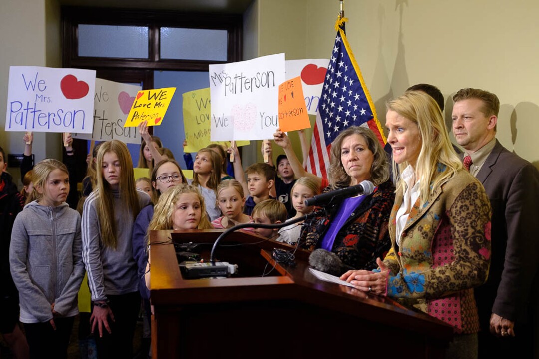 (Trent Nelson | The Salt Lake Tribune)  Valley View Elementary School students and teacher Moana Patterson listen as Tiffany Ivens-Spence speaks at a news conference by parents and students to show support for Patterson, in Salt Lake City on Monday March 11, 2019. Sen. Todd Weiler, R-Woods Cross, at right. Ivens-Spence is the parent of a student at the school.