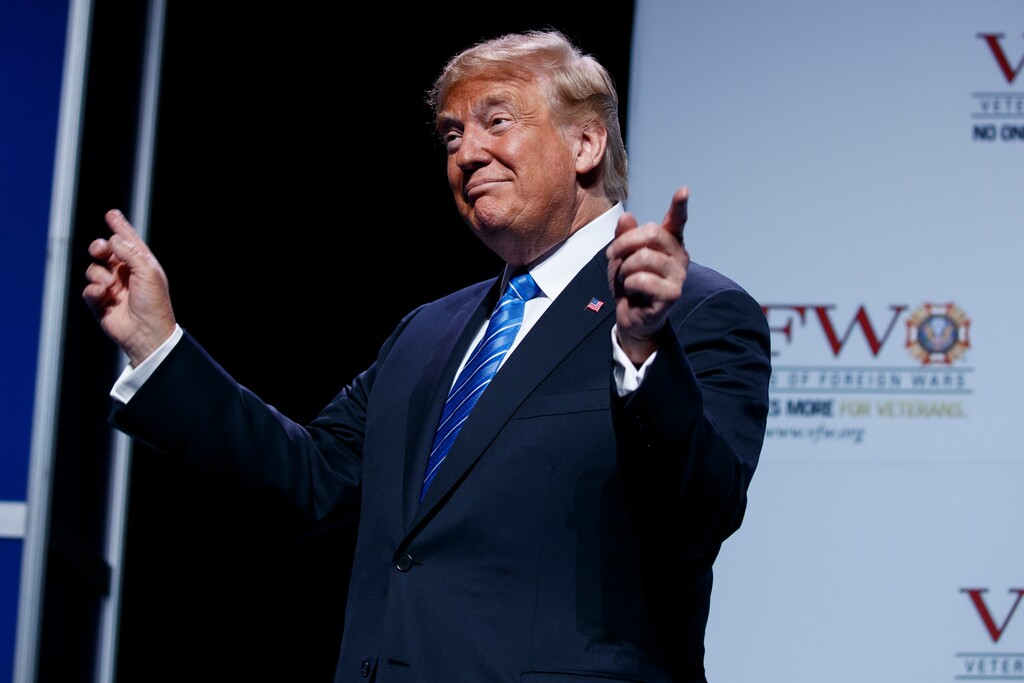 President Donald Trump gestures to music as he arrives to speak to the national convention of the Veterans of Foreign Wars, Tuesday, July 24, 2018, in Kansas City, Mo. (AP Photo/Evan Vucci)