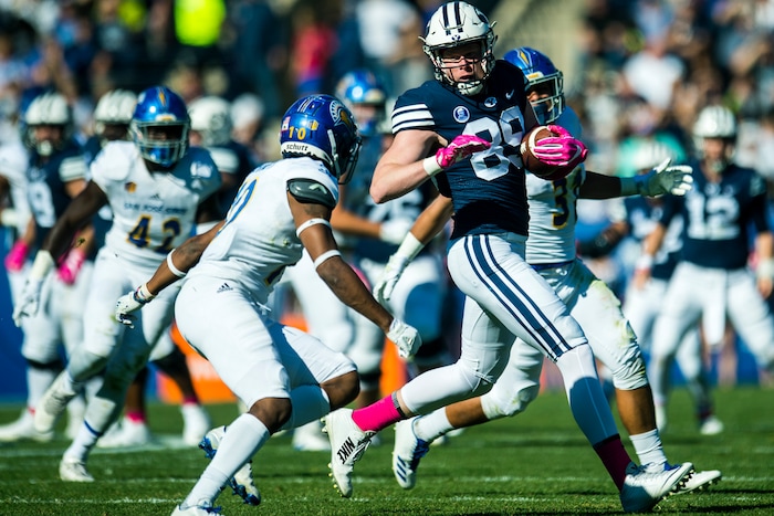 (Chris Detrick  |  The Salt Lake Tribune)  Brigham Young Cougars tight end Matt Bushman (89) runs past San Jose State Spartans safety Maurice McKnight (10) and San Jose State Spartans safety Ethan Aguayo (31) during the game at LaVell Edwards Stadium Saturday, October 28, 2017.  