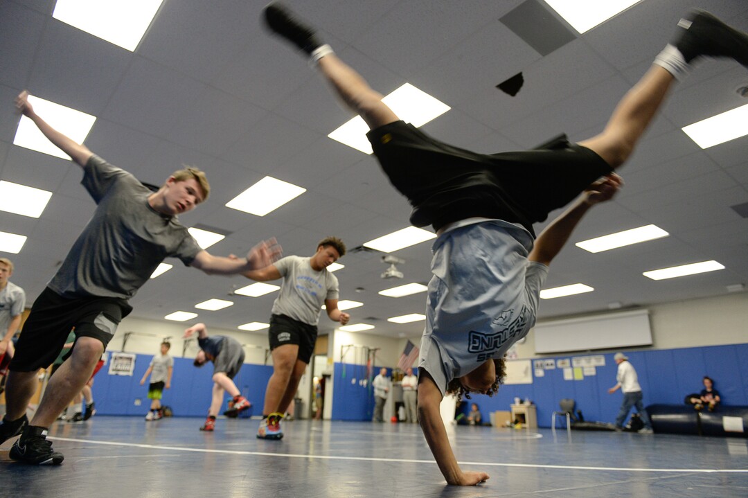 (Francisco Kjolseth  |  The Salt Lake Tribune)  Olympic wrestling champion Rulon Gardner runs an introductory clinic with young wrestlers at Herriman High School after being introduced as the new coach on Wed. May 17, 2018, as they get ready with their warm up exercises. 