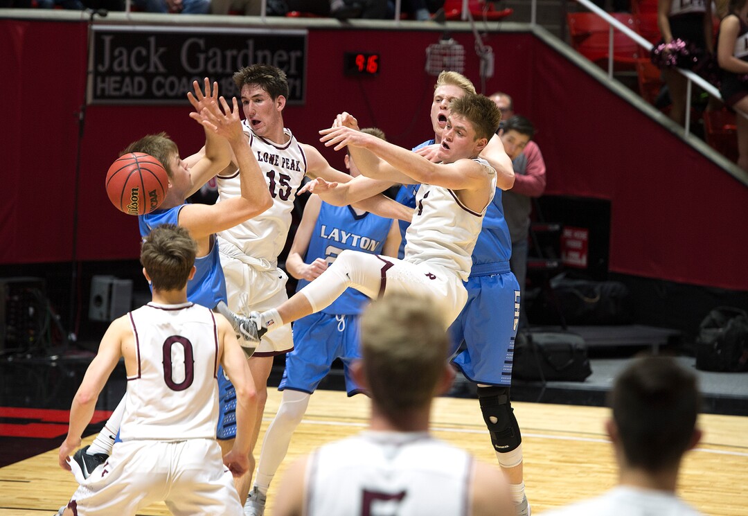 Scott Sommerdorf | The Salt Lake TribuneLone Peak and Layton battles for a loose ball during second half play. Lone Peak beat Layton 82-47, in a boy's 6A semi-final, FrIday, March. 2, 2018.