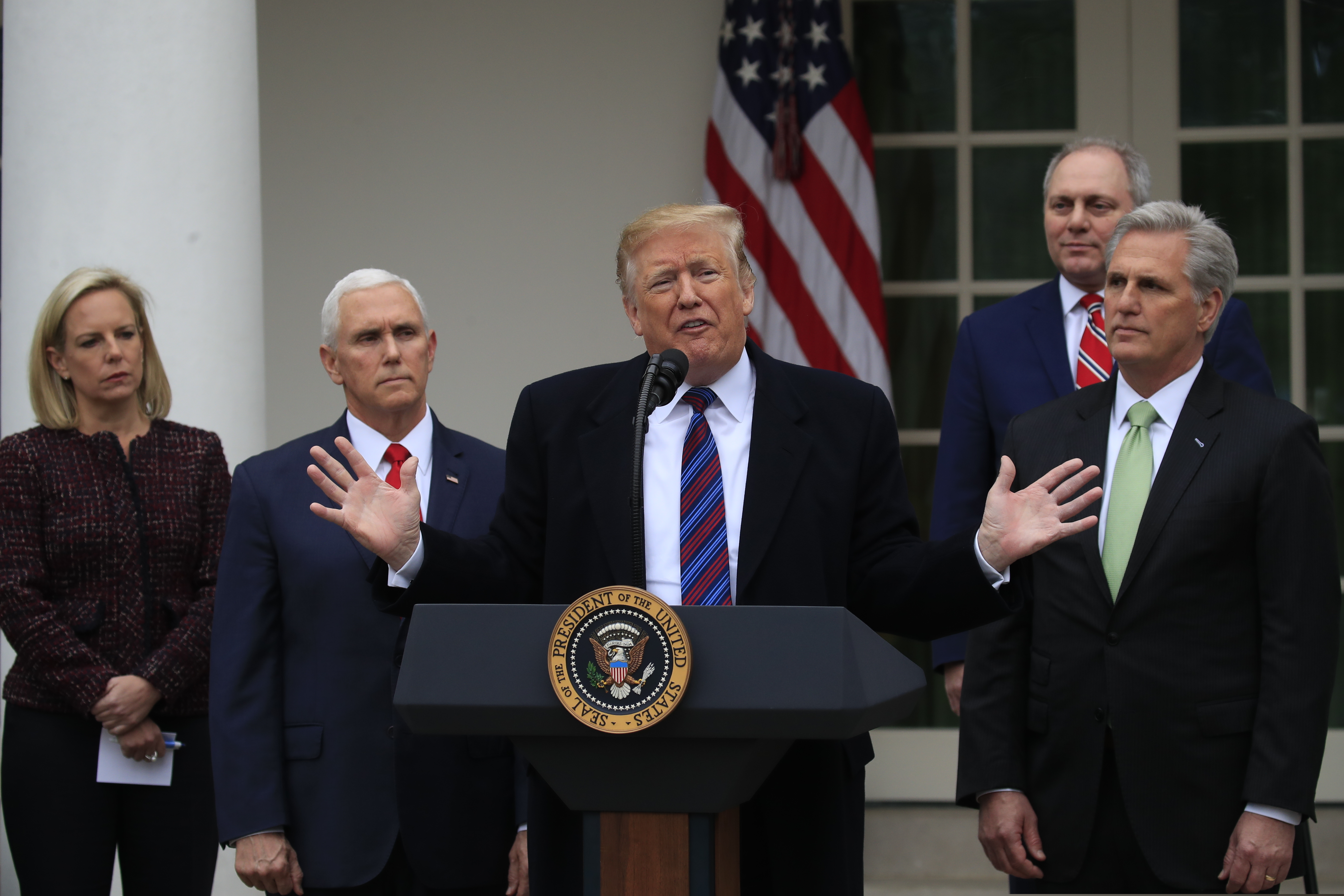 (AP Photo/Manuel Balce Ceneta) President Donald Trump speaks in the Rose Garden of the White House in Washington, after a meeting with Congressional leaders on border security, as the government shutdown continues Friday, Jan. 4, 2019, as Homeland Security Secretary Kirstjen Nielsen, Vice President Mike Pence, House Minority Whip Steve Scalise of La., and House Minority Leader Kevin McCarthy of Calif., listen.