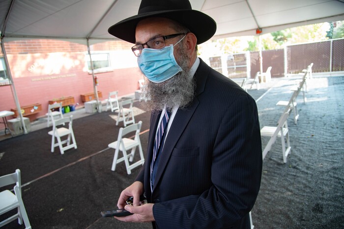 (Francisco Kjolseth  |  The Salt Lake Tribune) Rabbi Benny Zippel goes over safety set up plans with outdoor tents on Thursday, Sept. 17, 2020, for High Holy Day services, which begin Friday evening, so members of Chabad Lubavitch can meet in person, outside and socially distanced through the weekend.