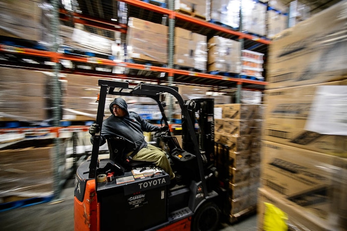 (Trent Nelson | The Salt Lake Tribune)
William Morrison operates a forklift at the Utah Food Bank in Salt Lake City on Wednesday Jan. 16, 2019.