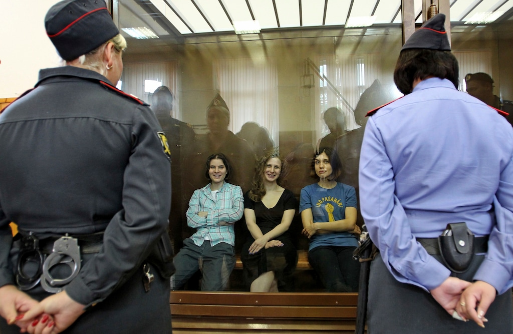 (Mikhail Metzel | The Associated Press) In this file photo taken on Friday, Aug. 17, 2012, Feminist punk group Pussy Riot members, from left, Yekaterina Samutsevich, Maria Alekhina and Nadezhda Tolokonnikova sit in a glass cage at a court room in Moscow, Russia. The women, two of whom have young children, are charged with hooliganism connected to religious hatred but the case is widely seen as a warning that authorities will only tolerate opposition under tightly controlled conditions.Vladimir Putin looks more invincible than ever before in his 18 years in power, after Russians invaded Ukraine, blanket-bombed Syria and hacked the U.S. election campaign.