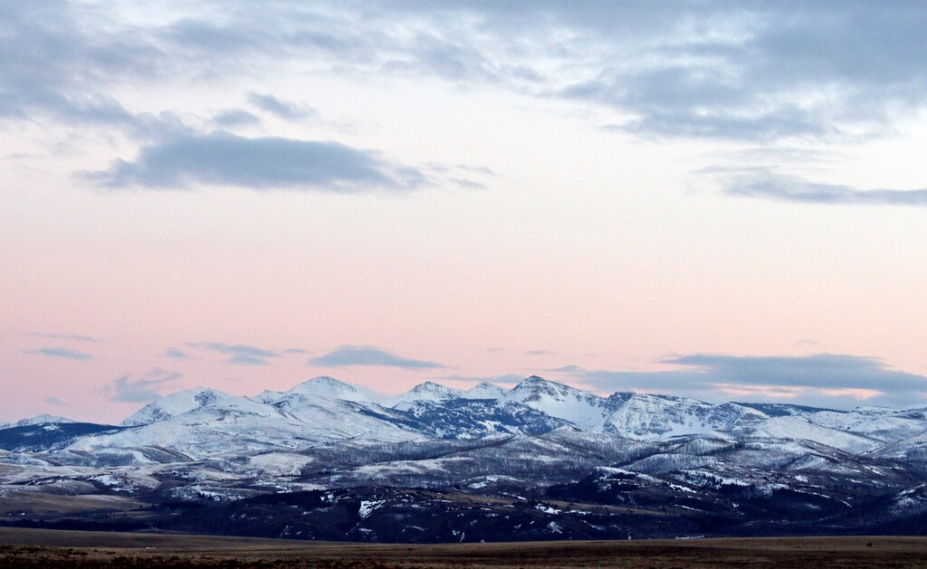 (Greg Lindstrom | Flathead Beacon via AP) In this March 25, 2016 photo, the sun sets over the Badger-Two Medicine area near Browning, Mont. Even as it clashes with American Indians over reductions to national monuments in the Southwest, the Trump administration is engaging with a Montana tribe over the creation of a new monument next to its reservation. The mountainous area was part of the Blackfeet reservation until the 1890s.
