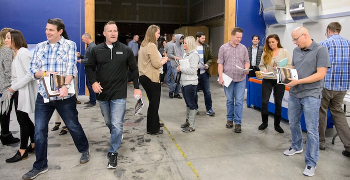 (Steve Griffin  |  The Salt Lake Tribune)  Access Development employees attend an open enrollment benefits meeting at the South Salt Lake company on Nov. 16, 2017.