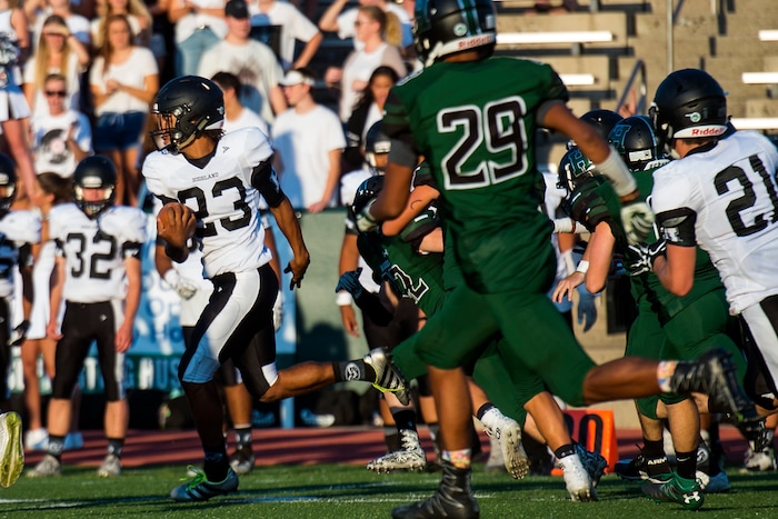 (Chris Detrick  |  The Salt Lake Tribune)    Highland's Trayton Keyes (23) returns the opening kick-off for a touchdown during the game at Hillcrest High School Friday, September 1, 2017. 