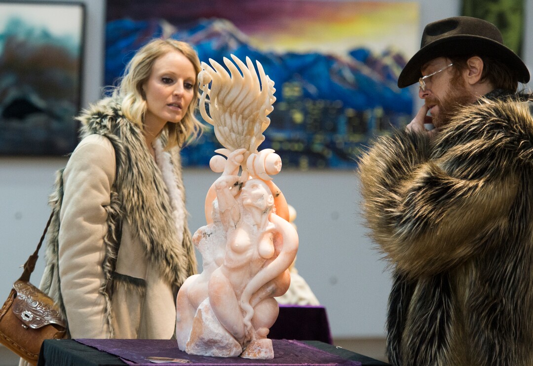 (Rick Egan  |  The Salt Lake Tribune)      Artist Mykael Lazzeri (right) talks about one of his art pieces with his wife Jamie, during the gallery stroll, at the Urban Arts Gallery, on Rio Grande Street, Friday, Nov. 16, 2018.