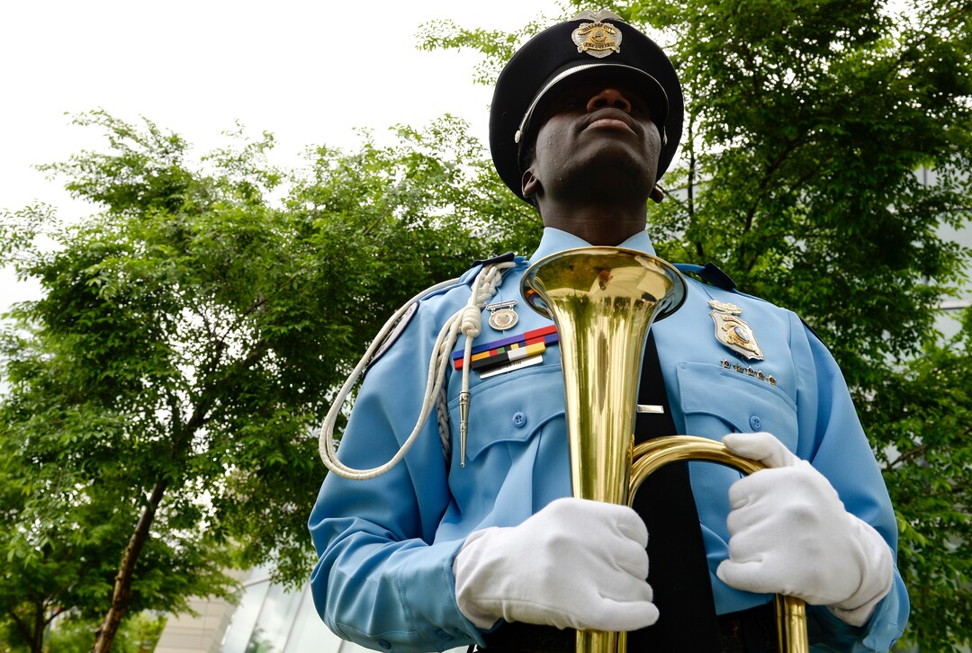 (Leah Hogsten  |  The Salt Lake Tribune)  Salah Eftin, a Salt Lake City Explorer honor guard member played Taps during the ceremony.  In honor of Police Week, the Salt Lake City Police Department honored its fallen officers with a memorial service and a 21-gun salute at the Public Safety Building, Thursday, May16, 2019.