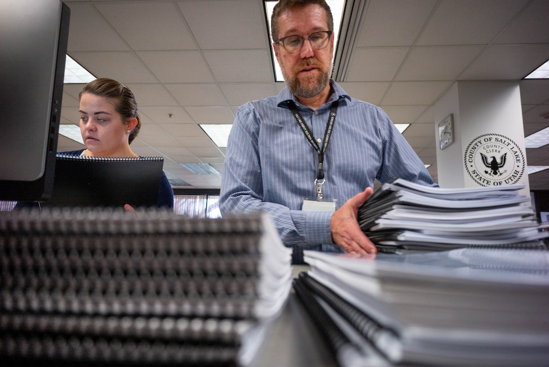 (Trent Nelson  |  The Salt Lake Tribune) Olivia Spencer and Bret Chappell sort through signed tax referendum petitions at the Salt Lake County Clerk's Office in Salt Lake City on Tuesday, Jan. 21, 2020.