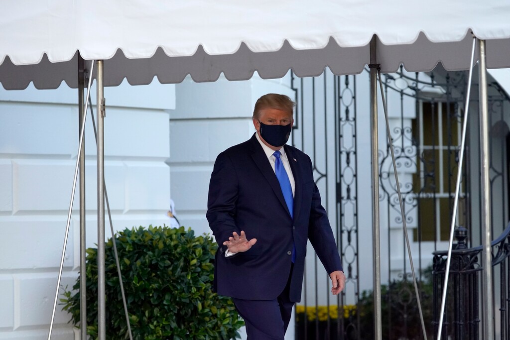 (AP Photo/Alex Brandon, File)
President Donald Trump waves to members of the media as he leaves the White House Friday to go to Walter Reed National Military Medical Center after he tested positive for COVID-19 in Washington. Trump told the world that he and first lady Melania Trump had contracted COVID-19 in a tweet at 12:54 a.m. Friday.