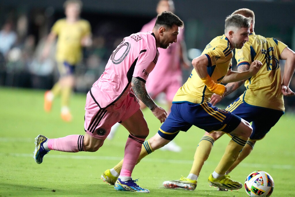 (Lynne Sladky | AP) Inter Miami forward Lionel Messi (10) runs for the ball as Real Salt Lake defender Andrew Brody defends during the second half of an MLS soccer match, Wednesday, Feb. 21, 2024, in Fort Lauderdale, Fla.