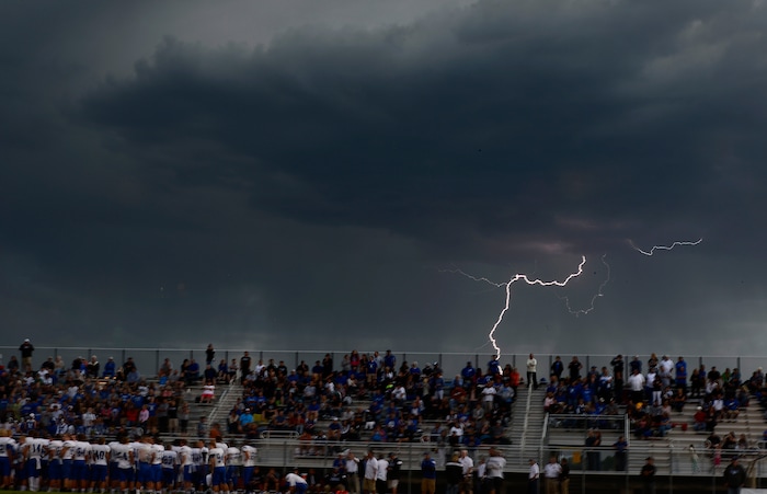(Scott Sommerdorf  |  The Salt Lake Tribune)  The game between 5A rivals Brighton and Bingham was halted for thirty minutes early in the first half as a lightning storm rolled through, Friday, September 26, 2014.