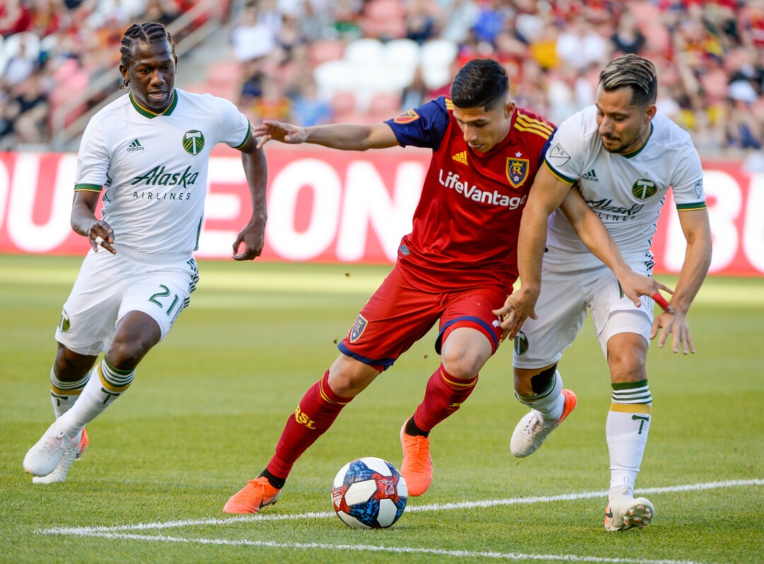 Leah Hogsten  |  The Salt Lake Tribune  Portland Timbers midfielder Diego Chara (21) and Portland Timbers midfielder Sebastian Blanco (10) pressure Real Salt Lake forward Jefferson Savarino (7). Real Salt Lake hosts the Portland Timbers, Saturday, May 4, 2019 at Rio Tinto Stadium in Salt Lake City.