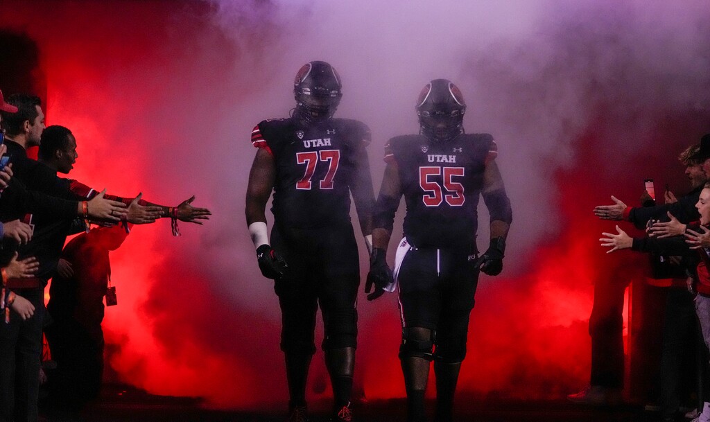 (Leah Hogsten | The Salt Lake Tribune) Utah Utes offensive lineman Bamidele Olaseni (77) and offensive lineman Nick Ford (55) get ready to take the field as the University of Utah hosts the UCLA Bruins in Pac-12 football, Saturday, Oct. 30, 2021 at Rice-Eccles Stadium.