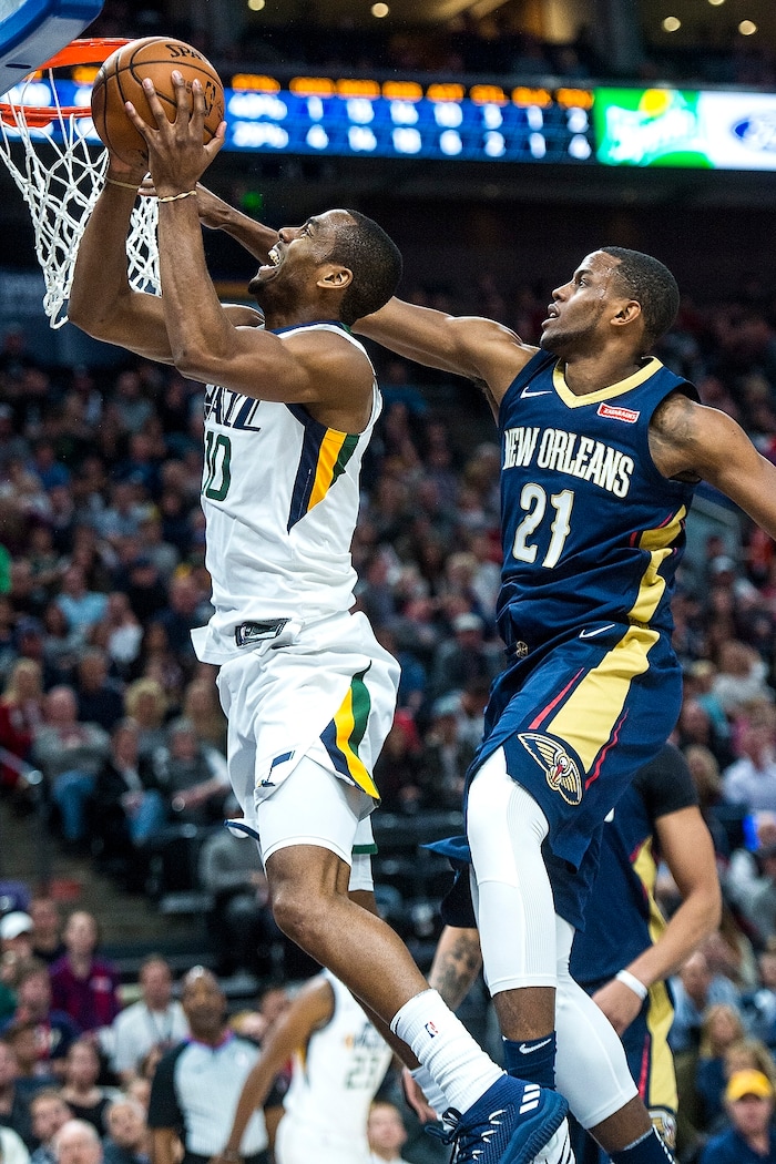 (Chris Detrick  |  The Salt Lake Tribune)  Utah Jazz guard Alec Burks (10) shoots past New Orleans Pelicans forward Darius Miller (21) during the game at Vivint Smart Home Arena Friday, December 1, 2017.  