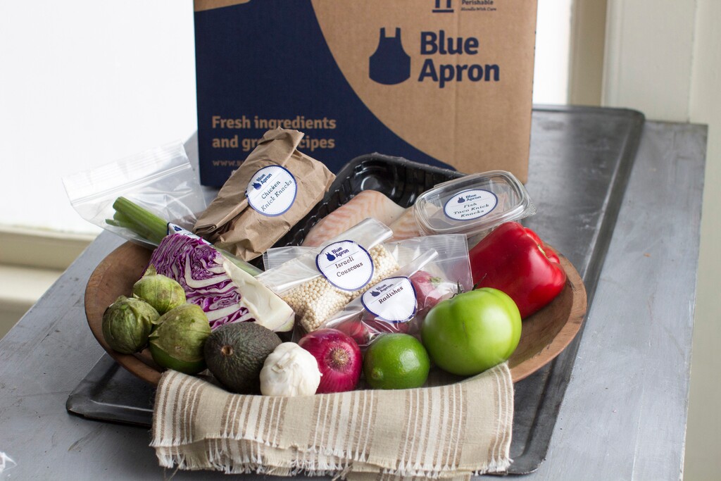 FILE - This Oct. 6, 2014, file photo shows an example of a home-delivered meal from Blue Apron, in Concord, N.H. On Wednesday, June 28, 2017, Blue Apron, the meal-kit delivery company, slashed the price it expects to sell its shares by as much as 40 percent, a sign that the company may be having trouble attracting investors. (AP Photo/Matthew Mead, File)