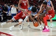 (Francisco Kjolseth | The Salt Lake Tribune) BYU Cougars center Abdullah Ahmed (34) fights for possession against Utah Utes guard Terrence Brown (2) and Utah Utes forward Kendyl Sanders (13) as Utah hosts BYU, NCAA basketball in Salt Lake City on Saturday, Jan. 10, 2026.