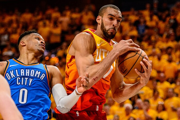 (Trent Nelson | The Salt Lake Tribune)  
Utah Jazz host the Oklahoma City Thunder, Game 3, NBA playoff basketball in Salt Lake City, Saturday April 21, 2018. Utah Jazz center Rudy Gobert (27) rebounds, with Oklahoma City Thunder guard Russell Westbrook (0) at left.