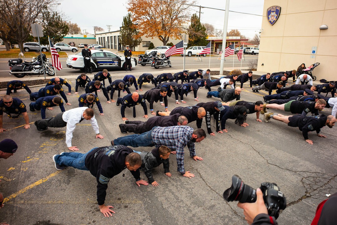(Trent Nelson  |  The Salt Lake Tribune) 
People do push-ups to honor Officer Romrell at the dedication ceremony of the David P. Romrell Public Safety Building on Sunday Nov. 24, 2019. The building is named after Officer Romrell, who was killed in the line of duty on Nov. 24, 2018 - one year ago.
