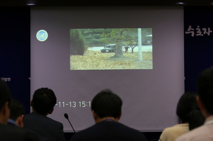 Journalists watch the CCTV footage regarding a North Korean soldier's defection during a press conference at the Defense Ministry in Seoul, South Korea, Wednesday, Nov. 22, 2017. A North Korean soldier made a desperate dash to freedom in a jeep and then on foot, being shot at least five times as he limped across the border and was rescued by South Korean soldiers, according to dramatic video released by the U.S.-led U.N. command Wednesday. (AP Photo/Ahn Young-joon)