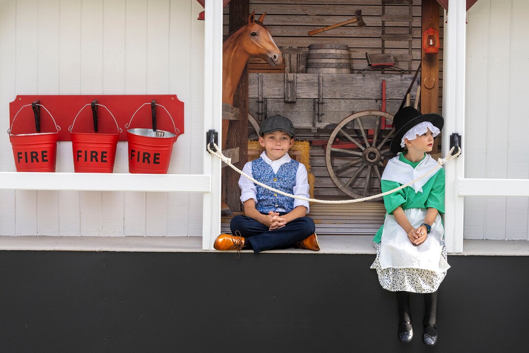 (Rick Egan | The Salt Lake Tribune) Benjamin Fuller, 10 and Eve Oldham, 9 ride in the Draper Stake's "Maid of Iowa" float, in the Days of '47 Parade with the Sons of the Utah Pioneers, in Salt Lake City, on Friday, July 23, 2021.
