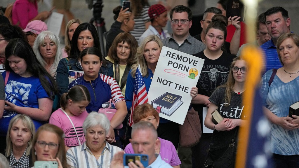 (Rick Bowmer | Associated Press) People gather at the Utah Capitol in Salt Lake City on June 7, 2023, to protest after Davis School District removed the Bible from elementary and middle schools. The district later reversed the decision; it has now updated its policy for banning books.