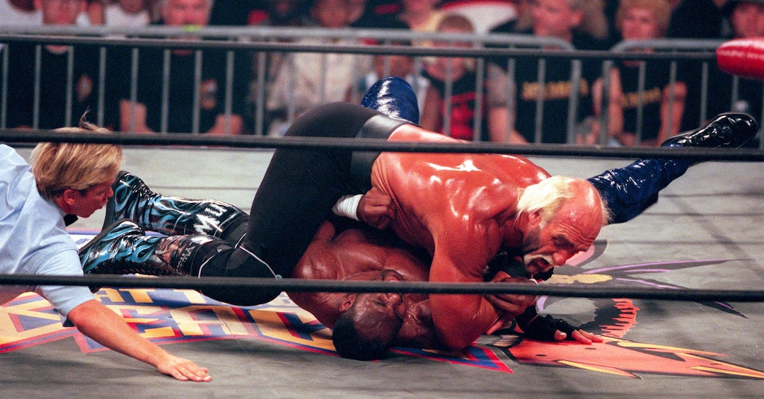 (Trent Nelson | The Salt Lake Tribune)  Karl Malone wrestles Hollywood Hulk Hogan at WCW's Bash at the Beach in San Diego. July 12, 1998.
