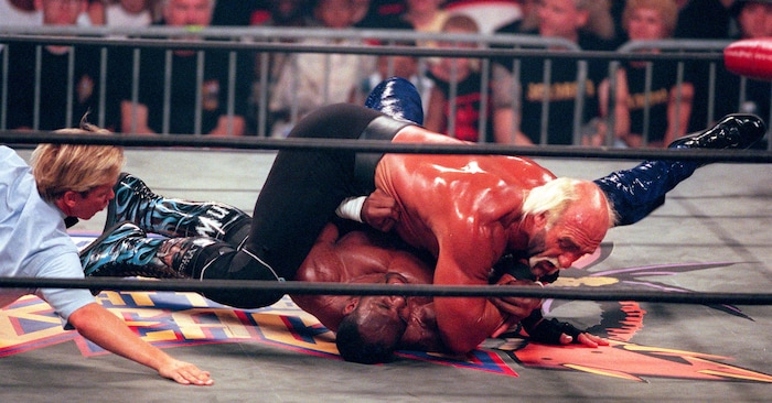 (Trent Nelson | The Salt Lake Tribune) Karl Malone wrestles Hollywood Hulk Hogan at WCW's Bash at the Beach in San Diego. July 12, 1998.