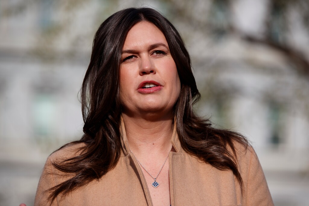 White House press secretary Sarah Sanders talks with reporters outside the White House, Thursday, April 4, 2019, in Washington. (AP Photo/Evan Vucci)