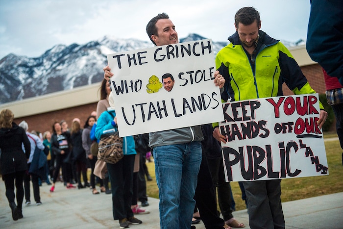 Chris Detrick  |  The Salt Lake Tribune
Richard Harmon, left, and Josh Hill, both of Salt Lake City, hold their signs before the town-hall meeting with U.S. Rep. Jason Chaffetz, R-Utah, outside of Brighton High School Thursday February 9, 2017. 