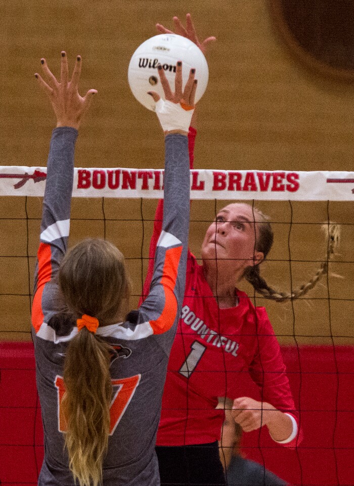(Rick Egan  |  The Salt Lake Tribune)  Baylee Mittelstaedt (1) hits the ball for Bountiful, as Brinley Watkins (17) defends for Skyridge, in volleyball action, Bountiful vs. Skyridge, at Bountiful High, Wednesday, September 6, 2017.