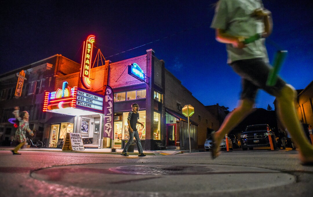 (Francisco Kjolseth  |  The Salt Lake Tribune)  Kids play on historic Main Street in Helper, Utah during a recent warm summer night known as Helper First Fridays. The gallery stroll night draws visitors the first Friday of every month that has seen a resurgence with artists joining natives, slowly reinventing the little town of just over 2,000 residents as an artist colony and tourist destination.