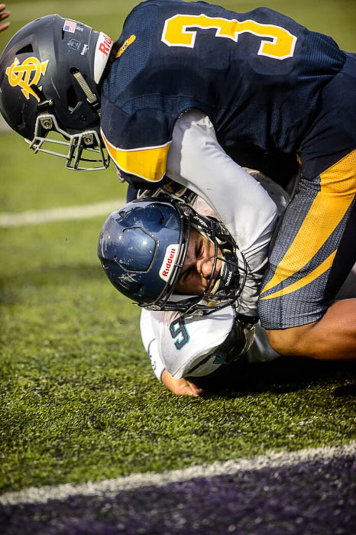 (Trent Nelson | The Salt Lake Tribune)  Juan Diego quarterback Zachary Hoffman is brought down by Summit Academy's Aloisio Sili, just short of the end zone. Summit Academy faces Juan Diego High School in a class 3A state semifinal football game at Weber State University's Stewart Stadium, Saturday November 4, 2017.