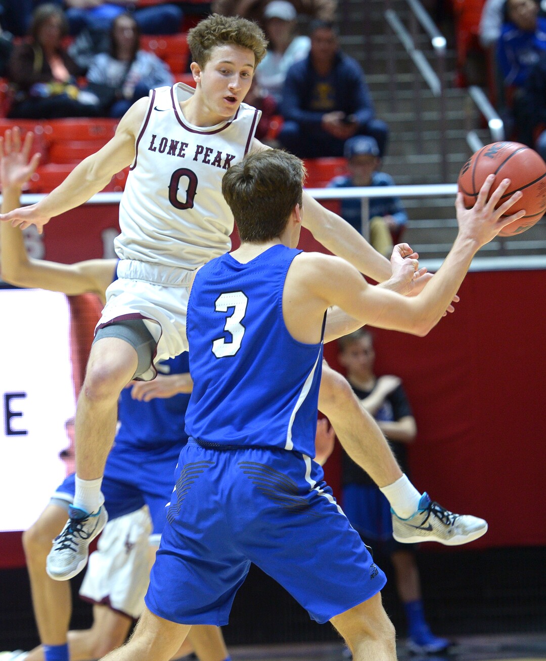 (Leah Hogsten  |  The Salt Lake Tribune) Pleasant Grove's Casey Brown (03) tries to get past the defense of Lone Peak's Chantry Ross (00). Lone Peak defeated Pleasant Grove 61-44 to win the 6A High School Boys’ Basketball Tournament Championship at the Jon M. Huntsman Center in Salt Lake City, Saturday, March 3, 2018. 