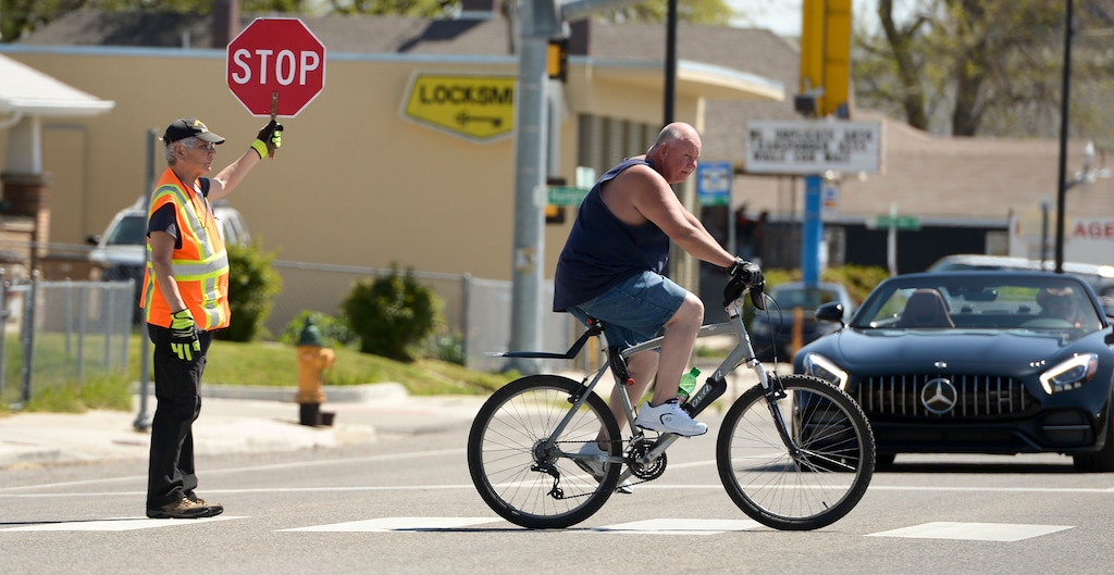 (Leah Hogsten | The Salt Lake Tribune) Crossing guard Manuel Hernandez works the east side of State Street and Harvard Avenue,Thursday, April 26, 2018. Hernandez said he's come close to getting hit by drivers hurrying to pass him and that he sees the middle finger a lot. Salt Lake City wants to find a solution at reducing the number of auto-pedestrian accidents on State Street.
