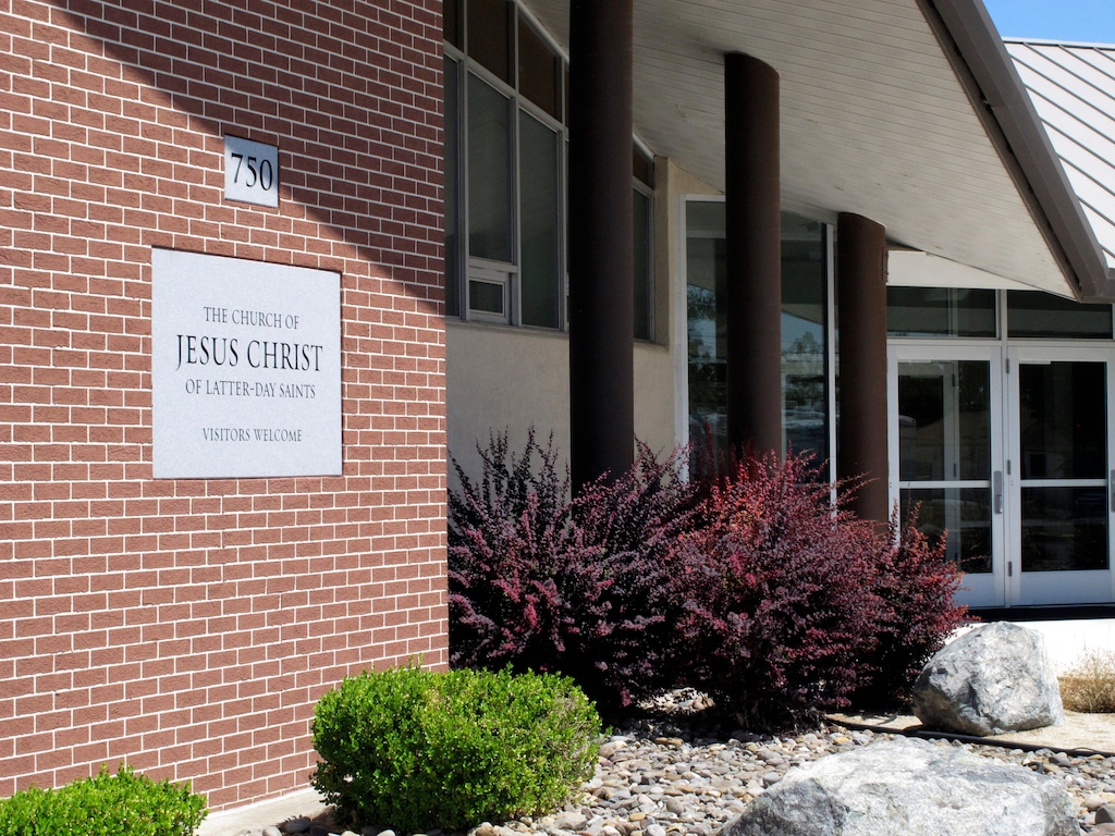 (Scott Sonner | AP file photo) In this July 23, 2018, file photo, The Church of Jesus Christ of Latter-day Saints church where a longtime rural Nevada volunteer firefighter was fatally shot during a Sunday services is shown in Fallon, Nev., about 60 miles east of Reno. The Church of Jesus Christ of Latter-day Saints has hardened its rules against bringing guns to church by tweaking the policy to say it is "prohibited" for anyone except police officers.