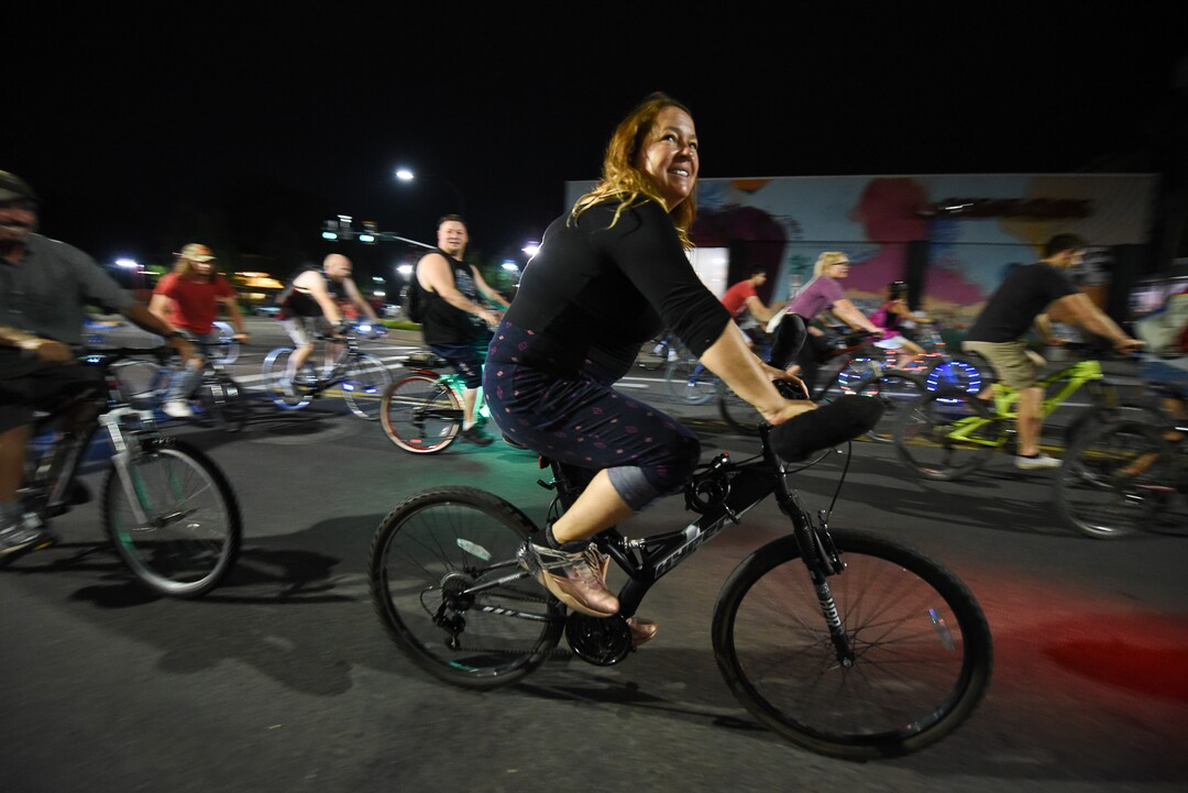 (Francisco Kjolseth  |  The Salt Lake Tribune)  A large group of cyclist begins their ride from the corner of 9th and 9th after gathering after 9pm in Salt Lake City on Thursday, July 26, 2018, for the weekly ride that has become known as the 999 Ride. The inclusive, all-welcoming slow casual social ride happens year round on Thursday nights, with riders often pedaling into the early morning hours. Newly released video shows rider Cameron Hooyer being struck and killed by a FrontRunner train at a downtown railroad crossing during last weeks ride when the 22-year-old failed to stop or heed the warning signals before crossing the tracks during the group ride. 