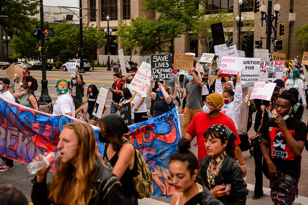(Trent Nelson  |  The Salt Lake Tribune) People march against police brutality in Salt Lake City on Saturday, June 13, 2020.