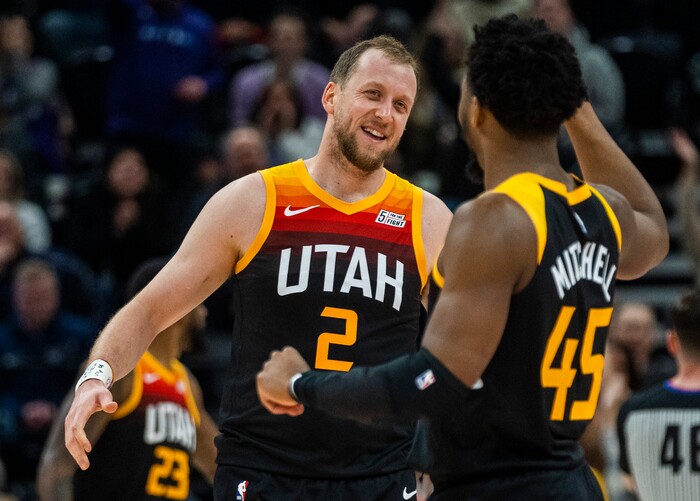 (Rick Egan | The Salt Lake Tribune) Utah Jazz guard Joe Ingles (2) celebrates with Donovan Mitchell (45) after Mitchell hit a big shot for the Jazz with 2:50 remaining the the game, in NBA action between the Utah Jazz and the Washington Wizards, at Vivint Arena on Saturday, Dec. 18, 2021.