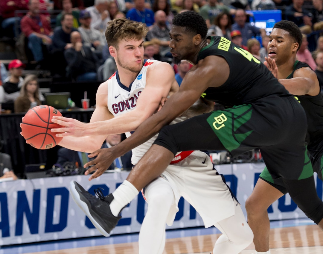 (Leah Hogsten  | The Salt Lake Tribune)  Gonzaga Bulldogs forward Corey Kispert (24) fights to keep the ball away from Baylor Bears guard Mario Kegler (4) as Baylor faces Gonzaga in the second round of the NCAA tournament in Salt Lake City on Saturday, March 23, 2019.