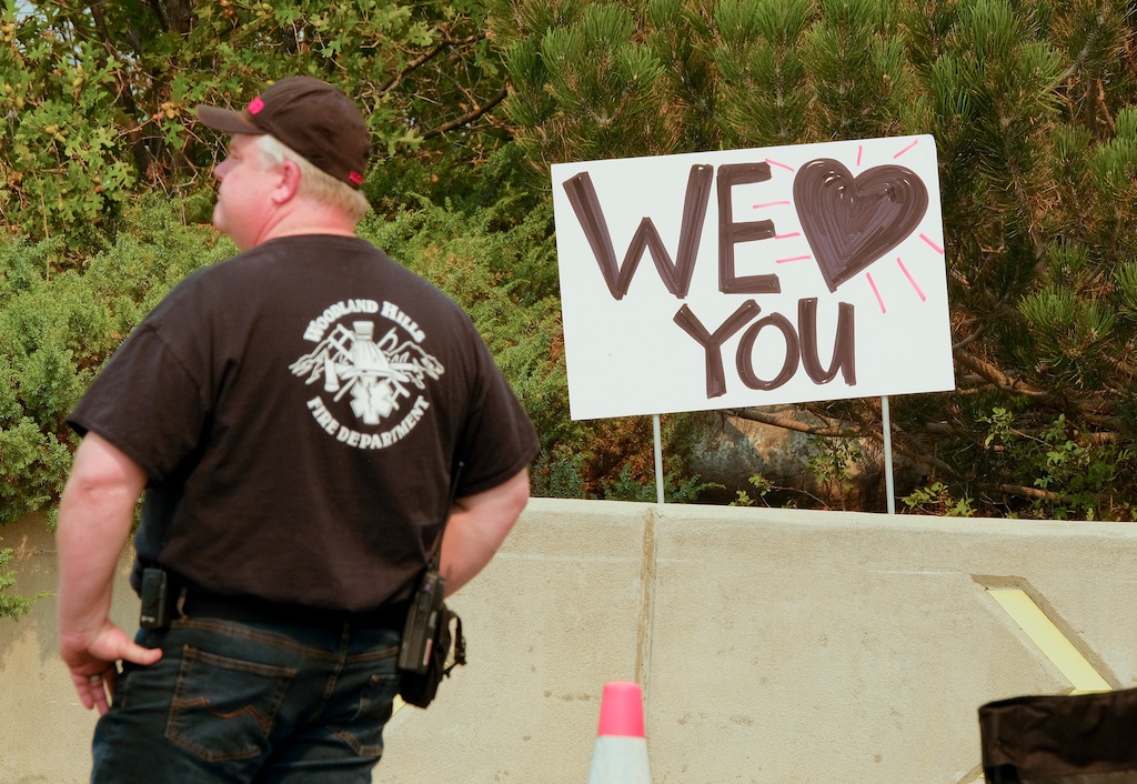Leah Hogsten | The Salt Lake Tribune Signs were put up in Woodland Hills thanking the firefighters, support crew and law enforcement agencies working the Pole Creek fire. Residents from Woodland Hills, under mandatory evacuation orders, were allowed to drive to their homes with a Utah County Sheriff's escort to retrieve pets and medications Saturday, Sept. 15, 2018.