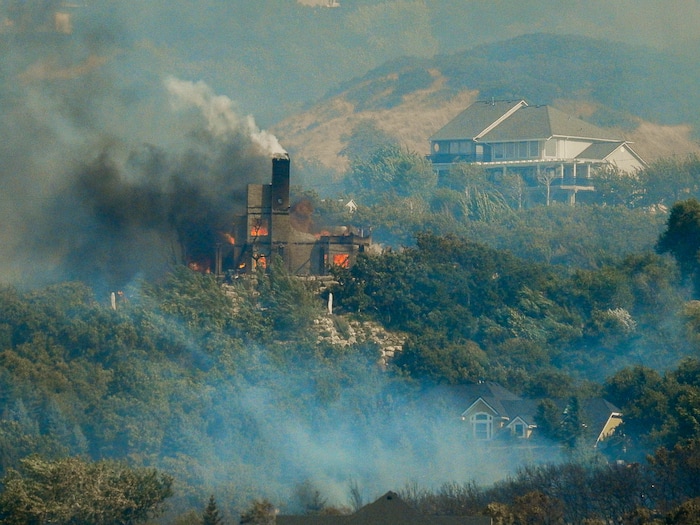 (Trent Nelson | The Salt Lake Tribune)  A home burns at the mouth of Weber Canyon, Tuesday September 5, 2017.