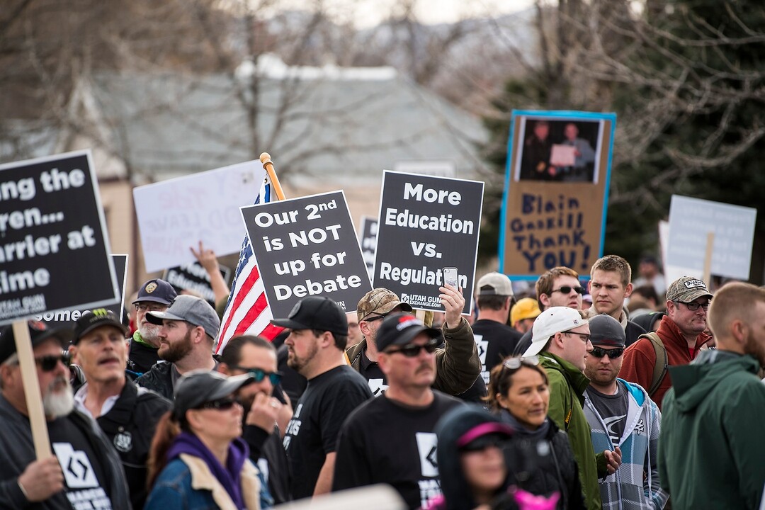 (Chris Detrick | The Salt Lake Tribune)  Participants hold signs during the March Before Our Lives rally near West High School in Salt Lake City Saturday, March 24, 2018.