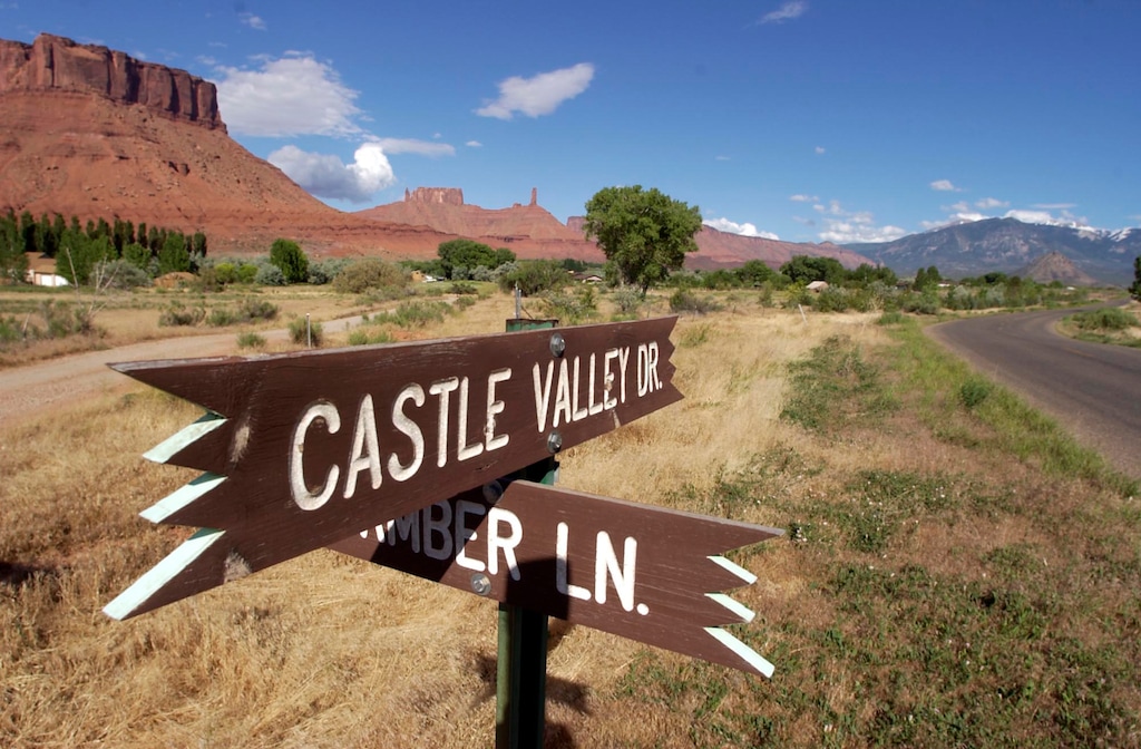 (Ryan Galbraith  | Tribune file photo)  Castle Valley Drive, the main road through the scenic community of Castle Valley, in Grand County. To the left is Parriott Mesa.
