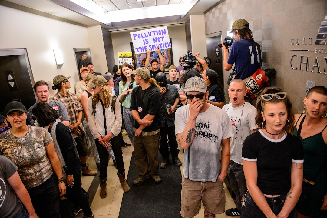 (Trent Nelson  |  The Salt Lake Tribune) Protesters occupy the Chamber of Commerce office in Salt Lake City on Tuesday, July 9, 2019. Dozens of people showed up to protest the proposed Inland Port and ended up clashing with police, resulting in temporary street closures and arrests.