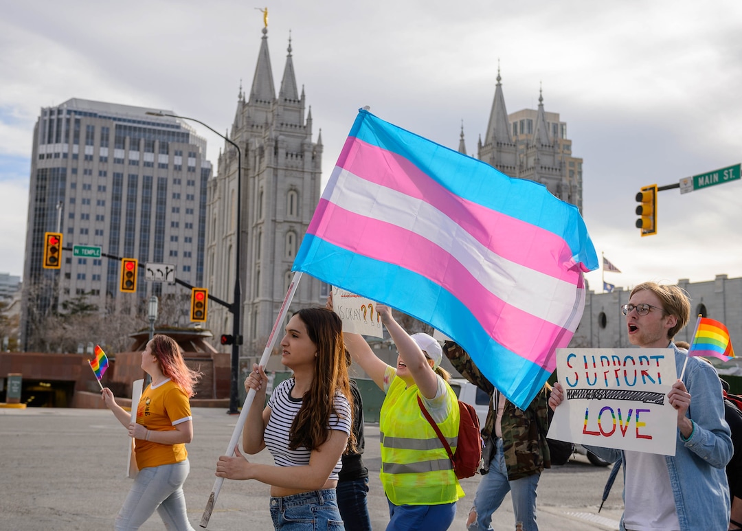 (Trent Nelson  |  The Salt Lake Tribune) Demonstrators at a rally about BYU's changing position on “romantic behavior” by same-sex couples march around the headquarters of The Church of Jesus Christ of Latter-day Saints in Salt Lake City on Friday, March 6, 2020.