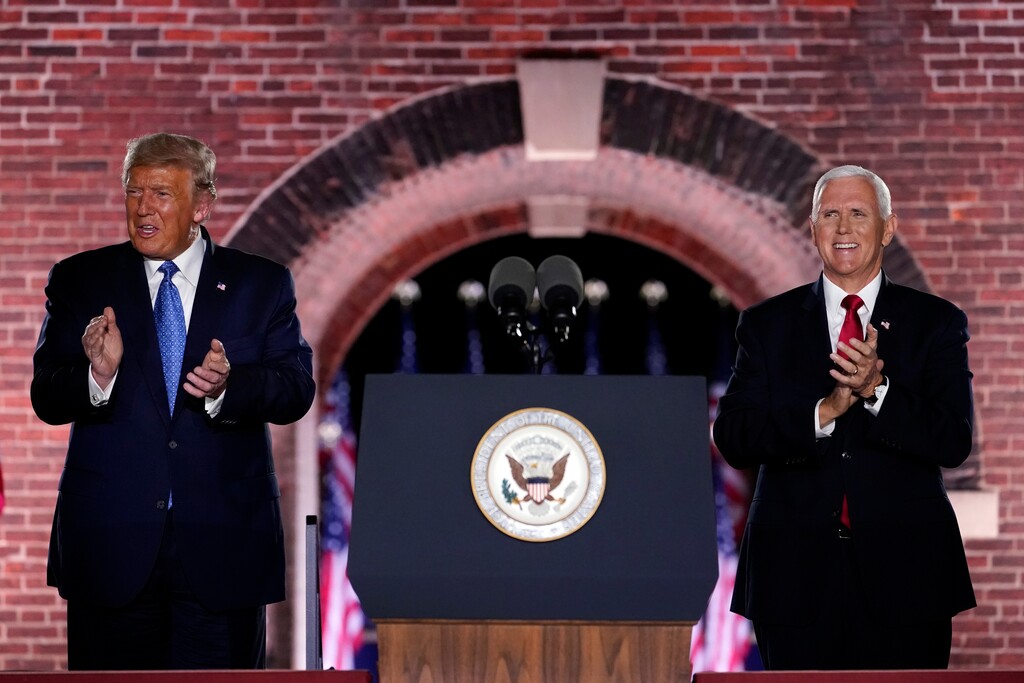 (Andrew Harnik | The Associated Press) Vice President Mike Pence stands on stage with President Donald Trump after Pence spoke on the third day of the Republican National Convention at Fort McHenry National Monument and Historic Shrine in Baltimore, Wednesday, Aug. 26, 2020.